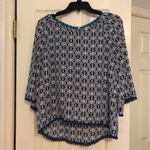 blue and white patterned blouse